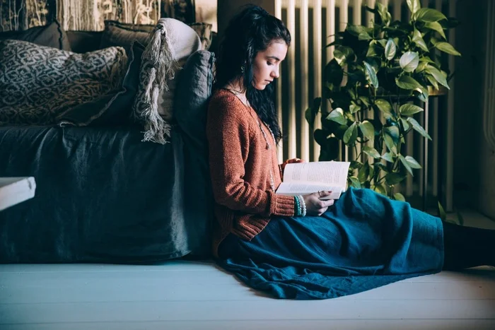 Woman sat down reading book